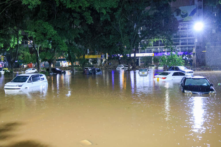 23 dead, flights disrupted and military deployed after heavy rains ...