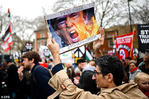 Leftist demonstrators chant 'victory to Iran' as they march through ...