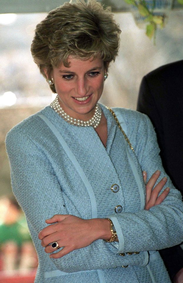 Princess Diana wearing her engagement ring on a visit to Tokyo. Credit: Tim Graham Photo Library via Getty Images