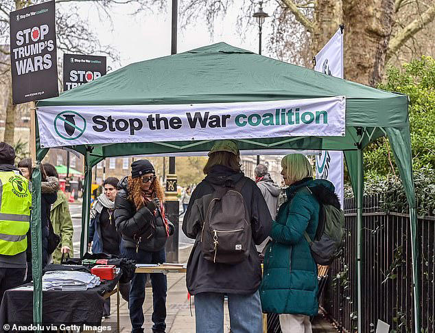 Leftist demonstrators chant 'victory to Iran' as they march through ...