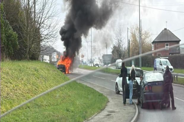 Car bursts into flames on busy Flintshire road