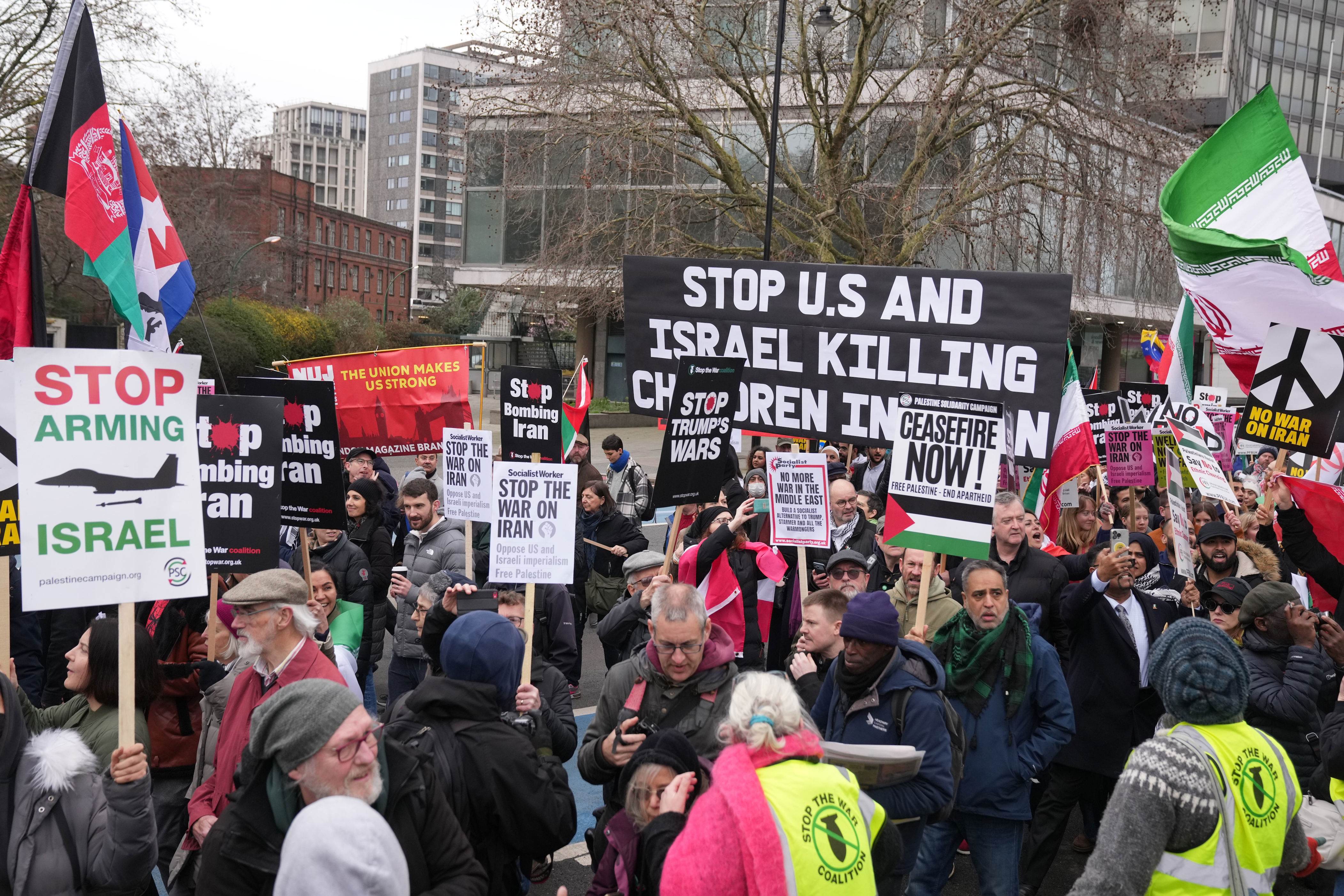 Thousands protest at US embassy in London calling for end to strikes on ...