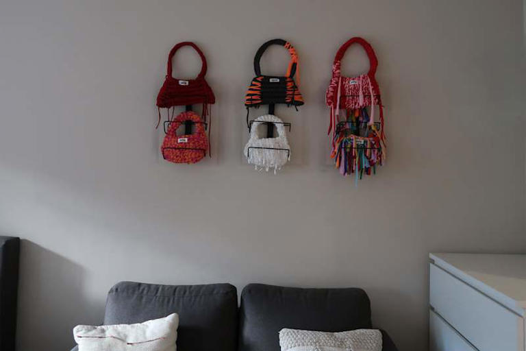 I used a wine rack for purse storage, and it was so cute