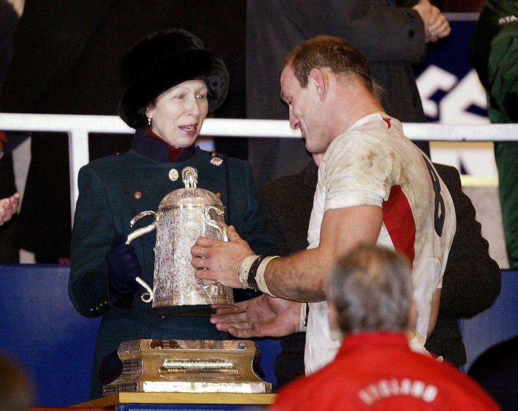 Princess Anne shows her cheeky side as she goes in for a hug during ...