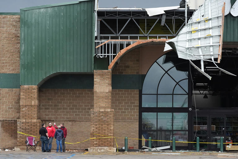 Photos show damage left by powerful storms as volunteers help ...