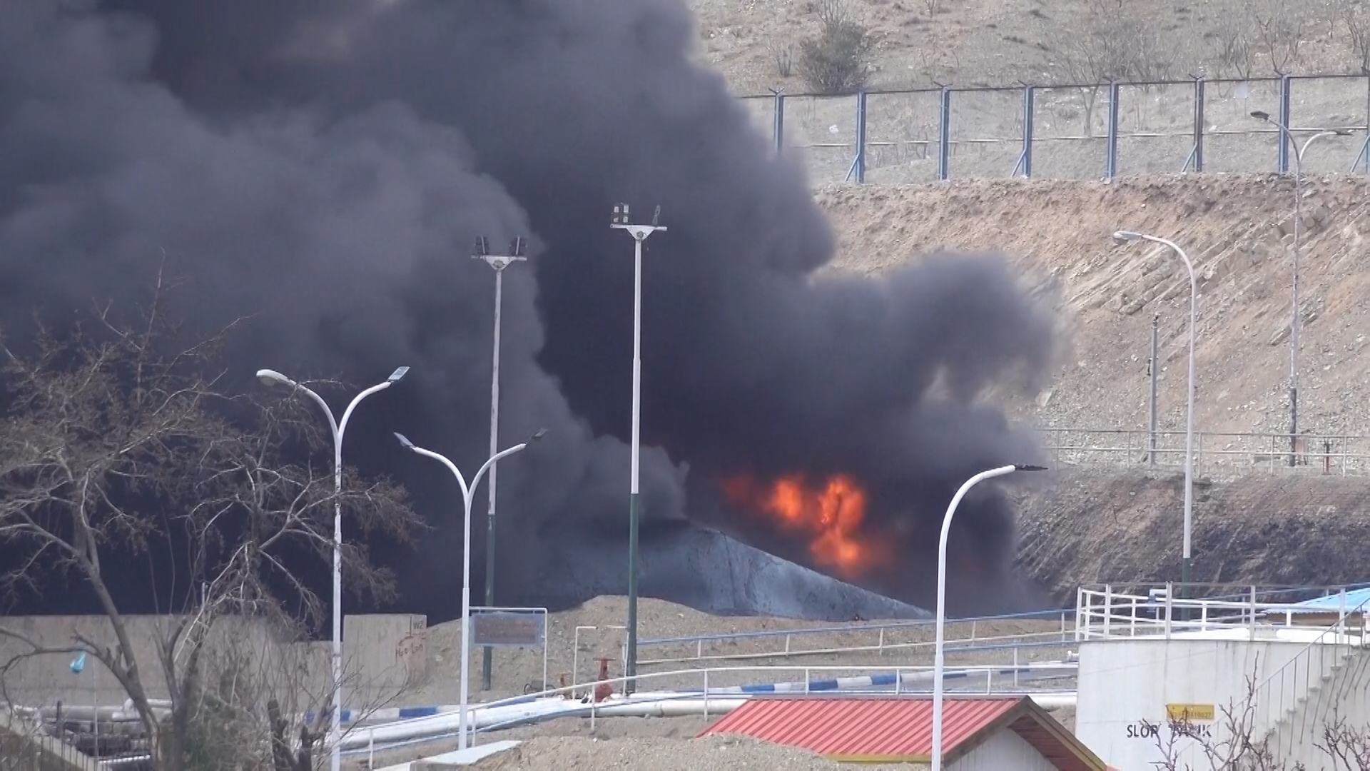 Massive black smoke engulfs Iran oil refinery after missile strike