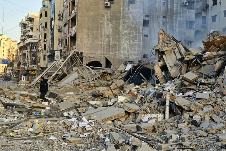 A man walks amid the rubble of a building at the site of overnight Israeli airstrikes in the southern suburbs of Beirut on March 6 (AFP via Getty Images)