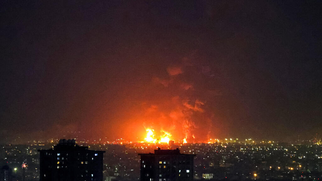 Black smoke plunges Tehran into darkness after Israeli strikes on oil ...