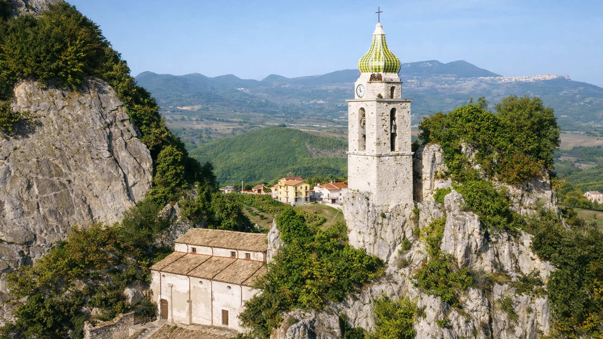 How was a bell tower built among rocky peaks?