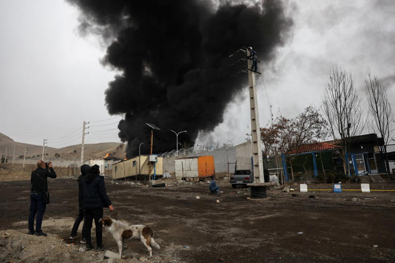 Toxic black rain pours down on Tehran, massive fireballs fill skies ...