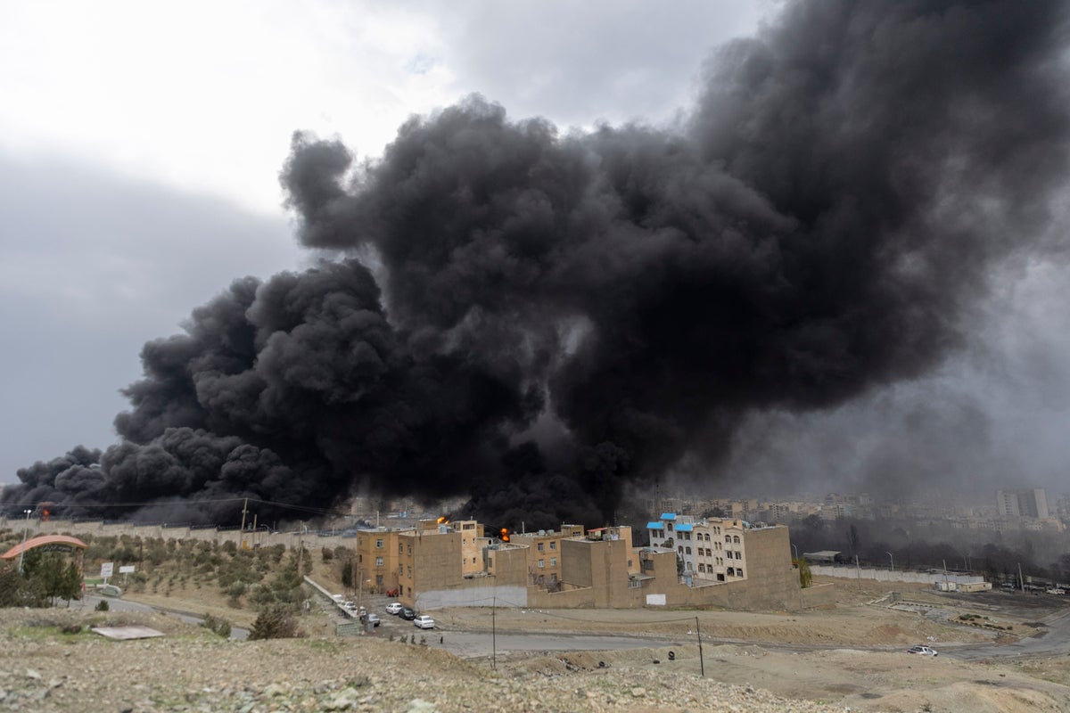 Tehran blanketed in smoke after Israel hits fuel storage sites