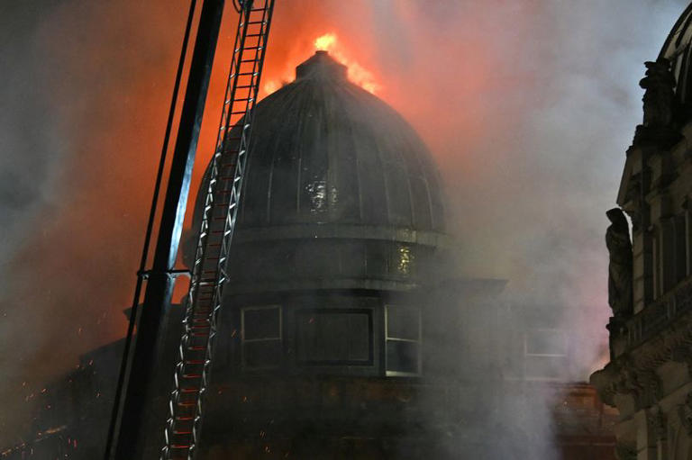 Part of UK train station 'collapses' during huge blaze as firefighters ...