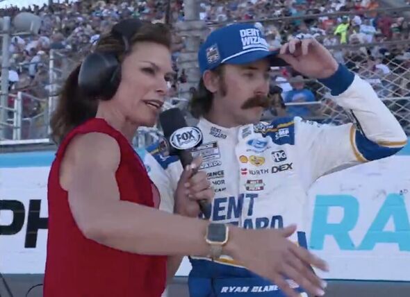 NASCAR star forced to stop post-win interview as empty car rolls away