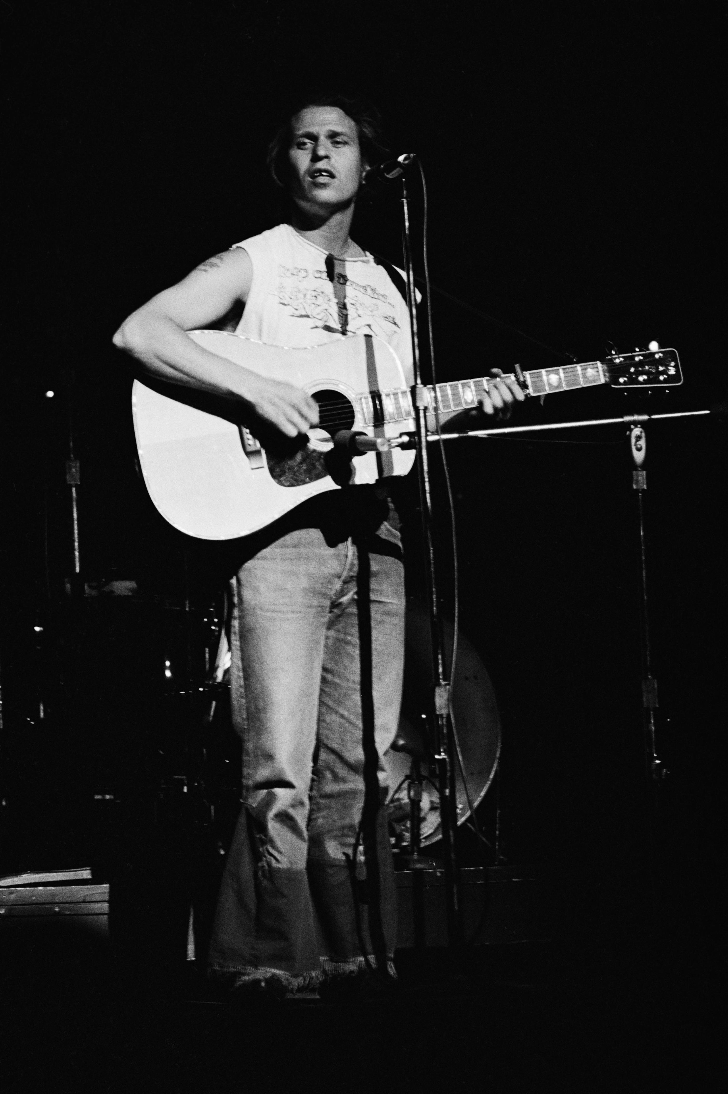 Revisit Country Joe McDonald's career, starting with Woodstock