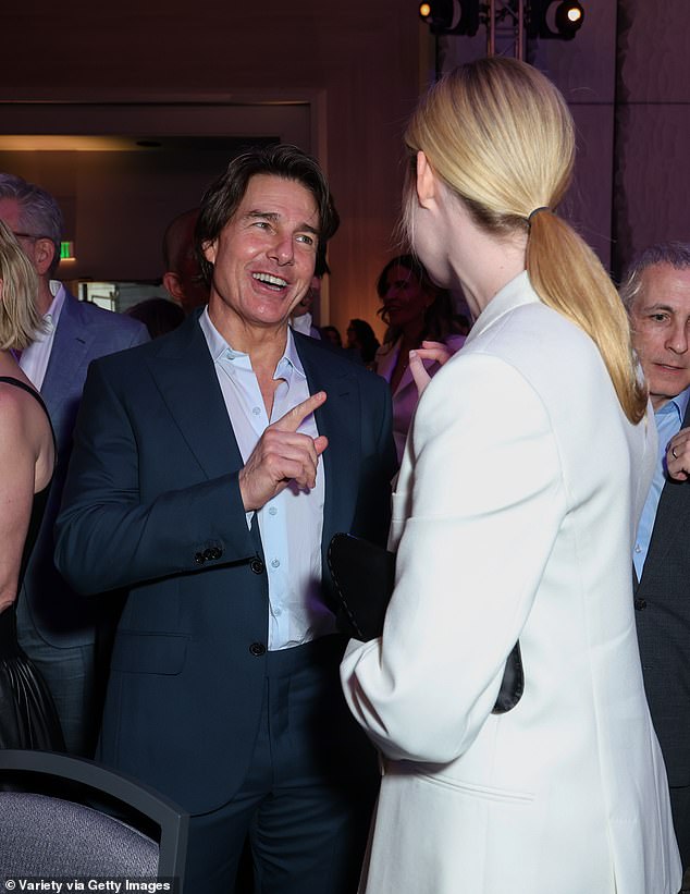 Tom Cruise enjoys rare award show appearance as he poses with Elle ...