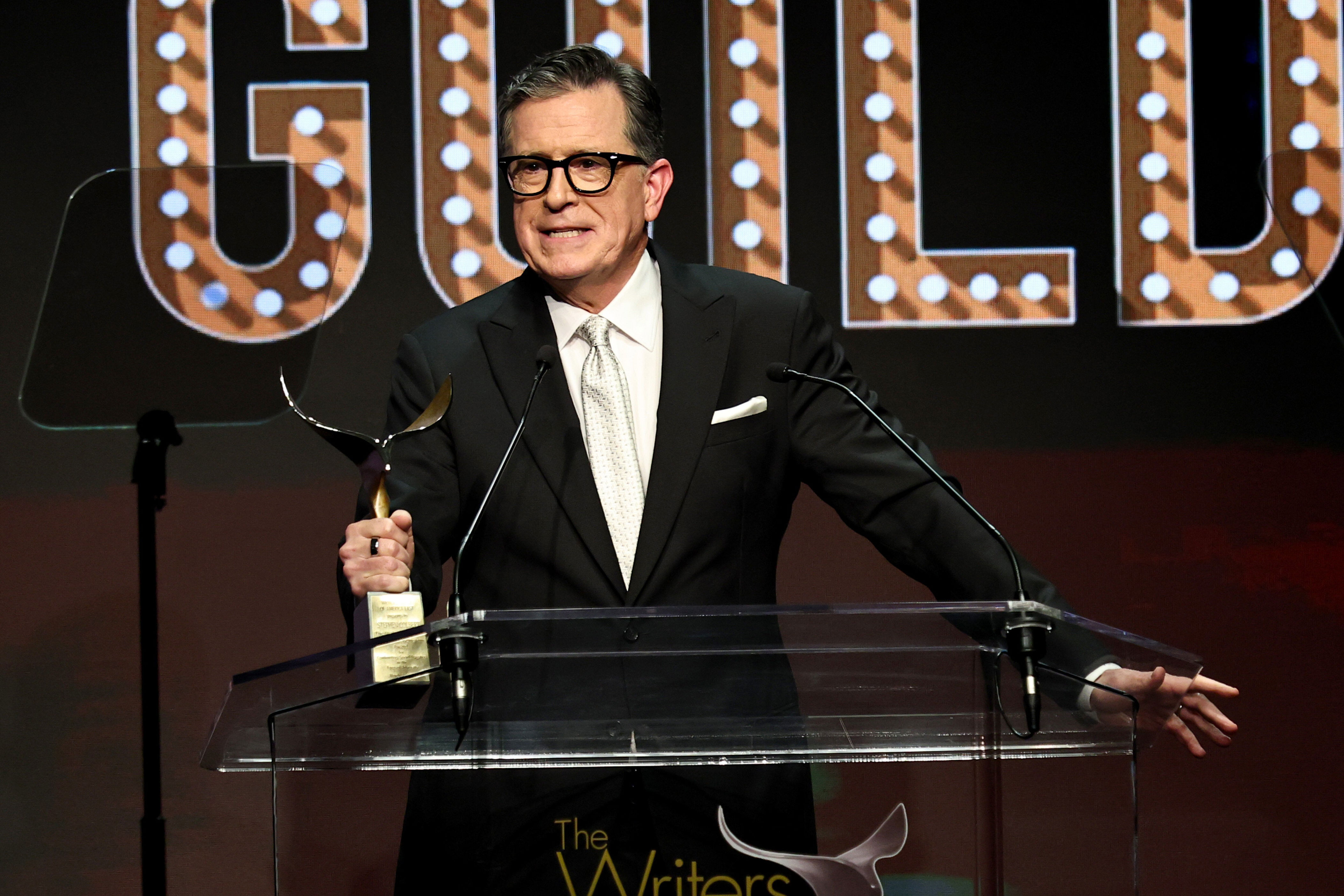 Stephen Colbert takes aim at his corporate bosses in blunt awards speech moment<br>