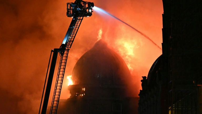 Fire fighters work to control a large fire in Glasgow City centre on March 8, 2026. (Photo by ANDY BUCHANAN / AFP)