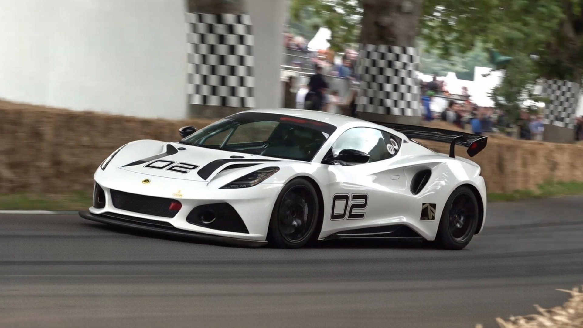Lotus Emira racing through a tight hill climb course