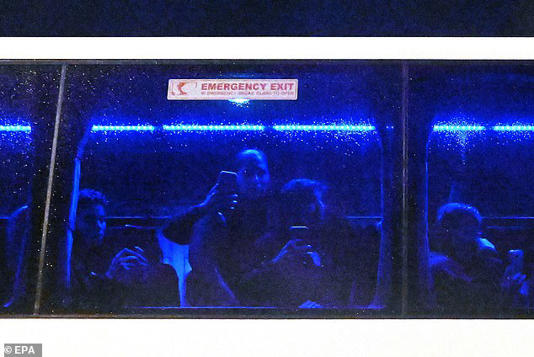 Players inside the bus filmed the protest (pictured) and at least one reportedly gave the international signal for SOS