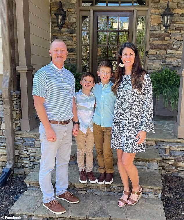 Jason Hughes is pictured with his wife and children