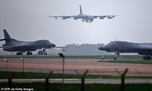 Three B-52 bombers touched down at RAF Fairford, in Gloucestershire, after the US President warned Tehran 'the big one' was coming
