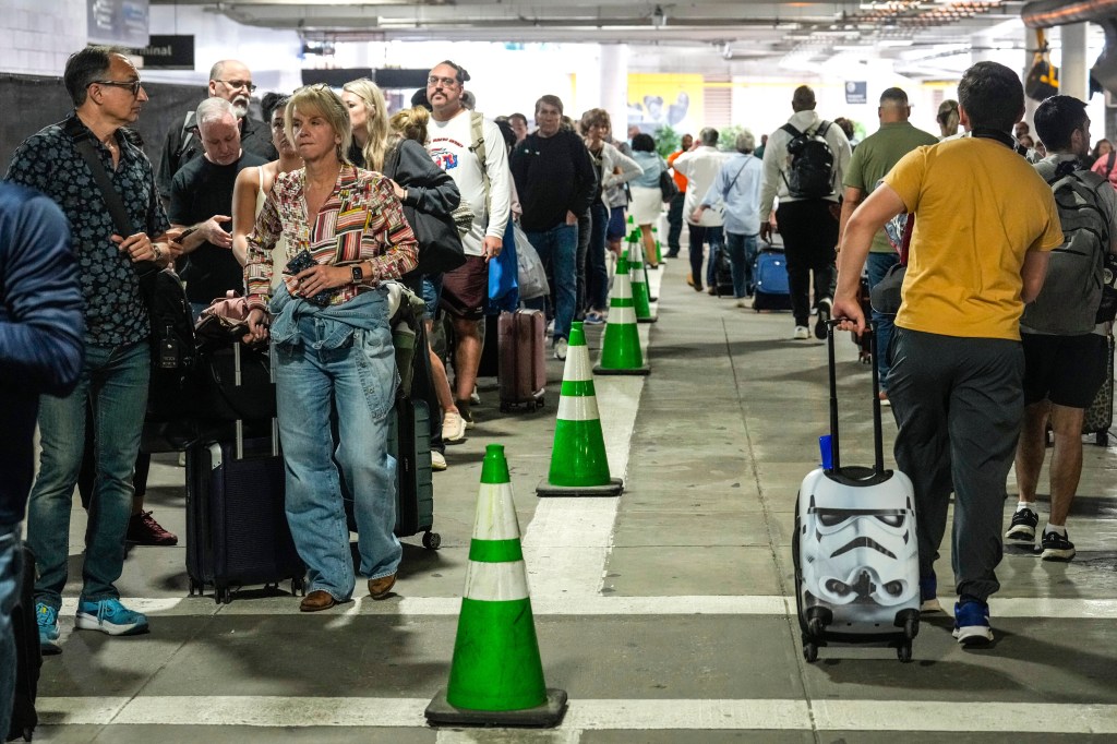 Fuming travelers wait in airport security lines for hours due to TSA ...