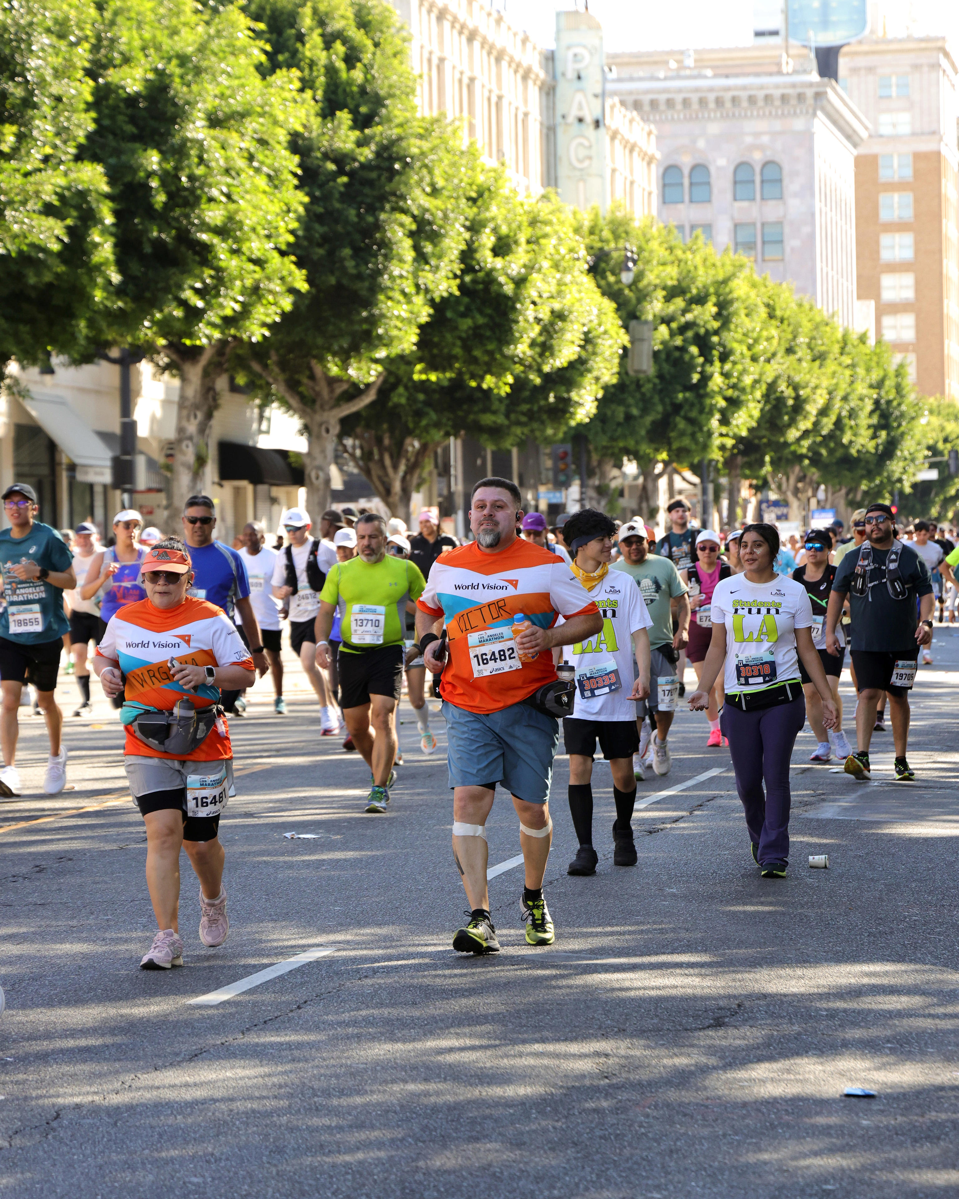 High school cross county coach wins LA Marathon in closest finish ever