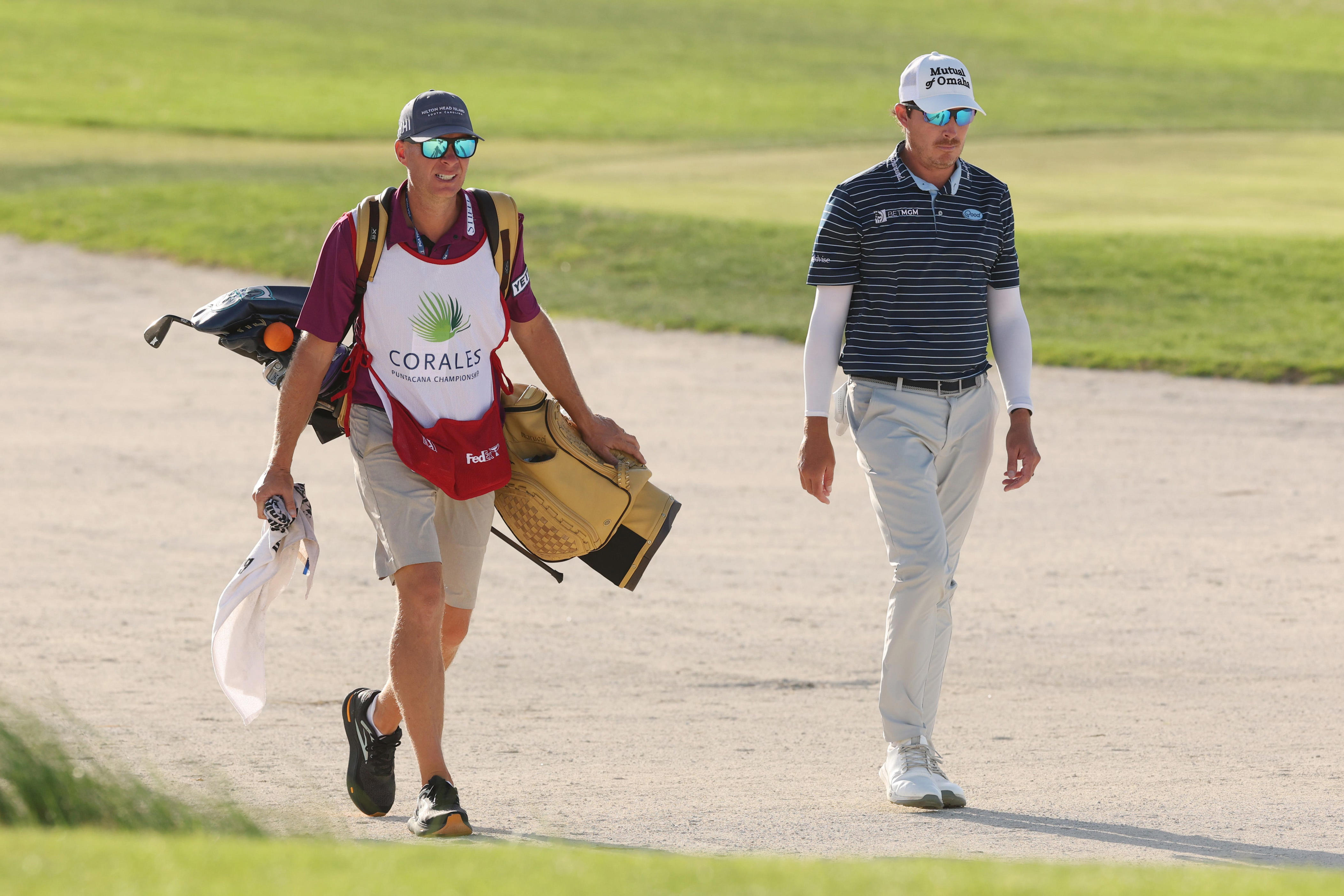 Joel Dahmen and caddie Geno Bonnalie walk the 17th hole during the final round of the 2025 Corales Puntacana Championship at Puntacana Resort & Club.