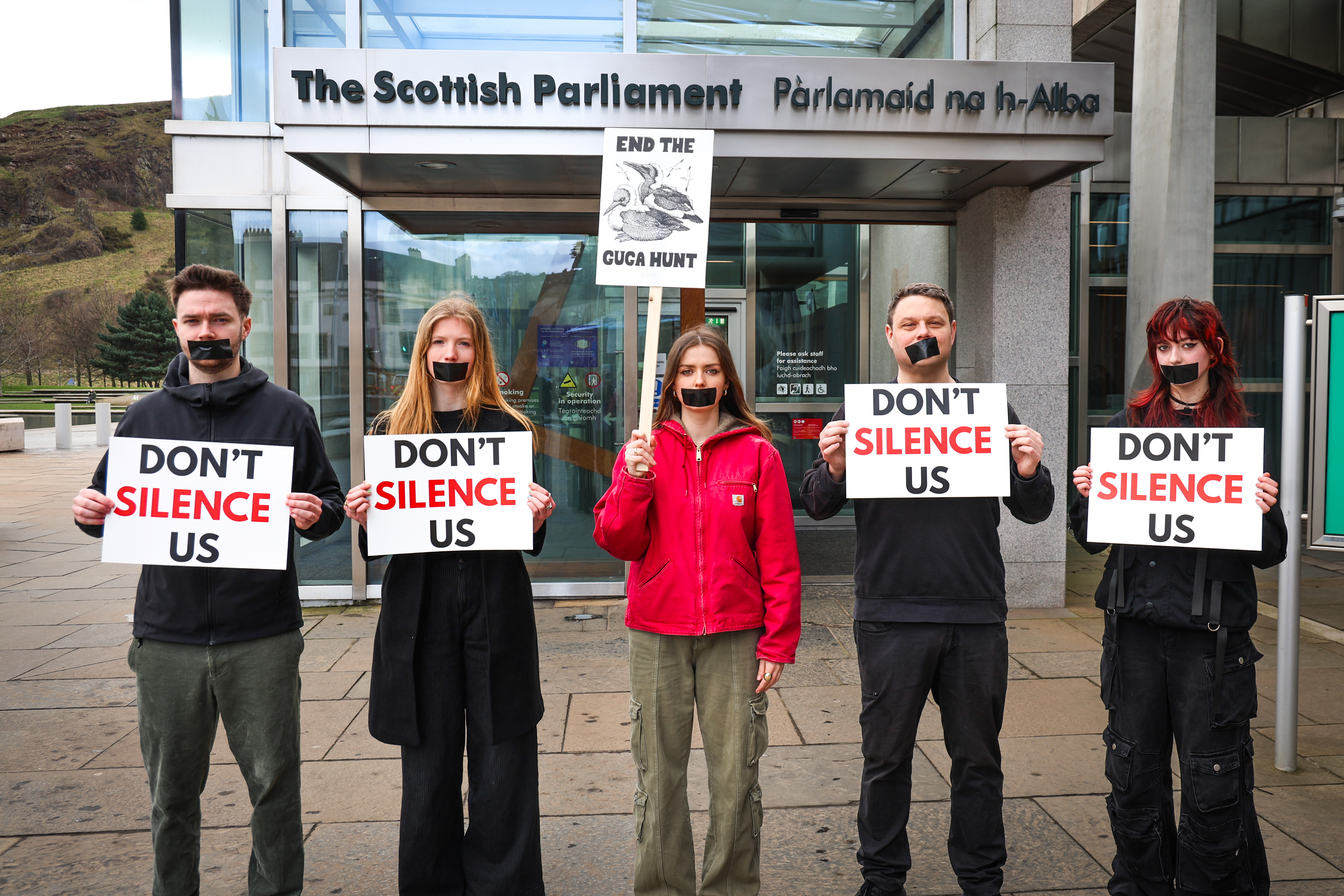 Activists hold silent protest outside Scottish Parliament ahead of ...