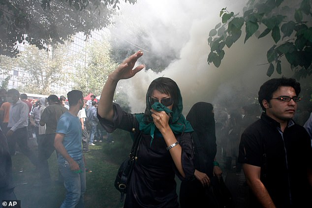 An Iranian female opposition supporter reacts as she attends a protest in Tehran, Iran, Friday, Sept. 18, 2009