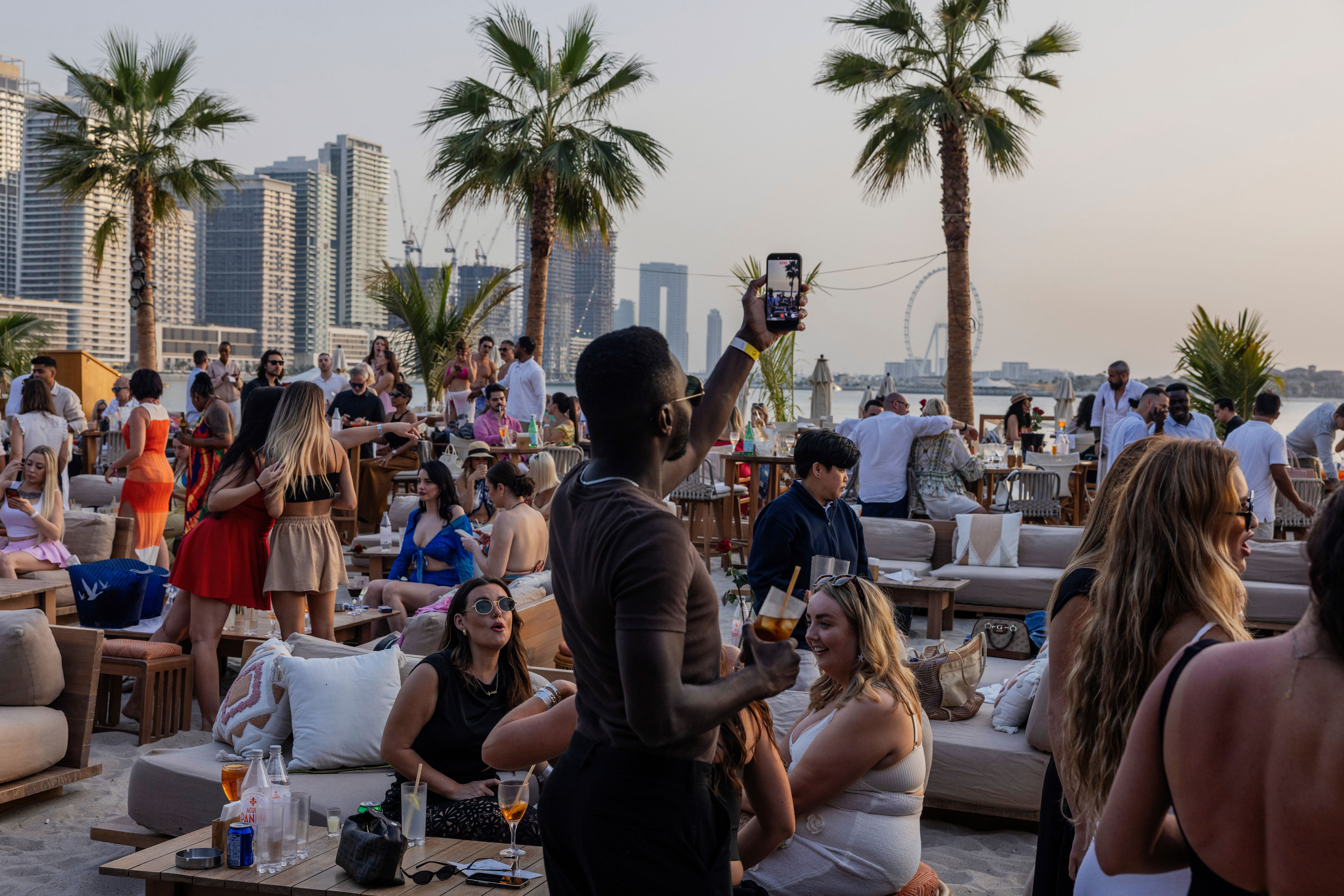 UAE, oasis for business and partying, faces war