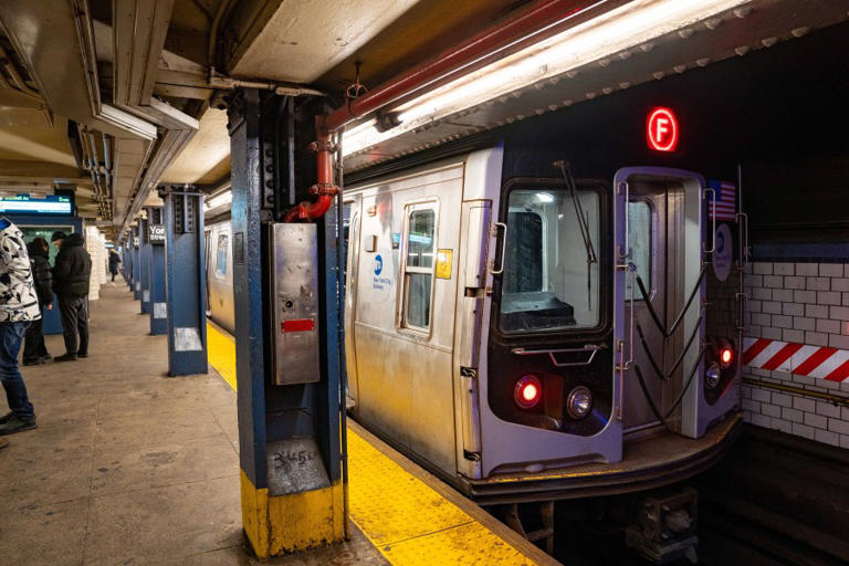 Person of interest in custody after two pushed on subway tracks
