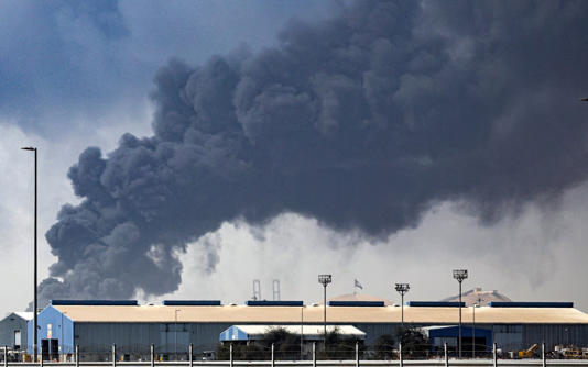 Smoke billows from the Jebel Ali port in Dubai after debris from an intercepted Iranian missile struck it - EPA/Shutterstock