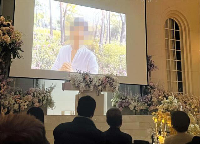 A video recreating a deceased mother using AI (artificial intelligence) is shown at a wedding venue. /Courtesy of Reader