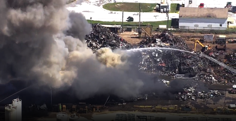 Scrapyard fire burning in Orange County near MCO