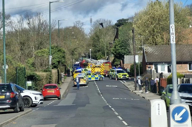Car flips on St Ann's Road as emergency services free people trapped inside