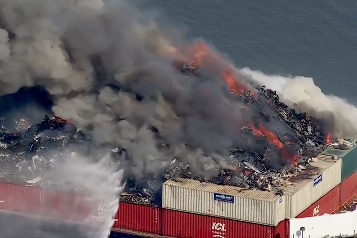 Massive fire erupts on scrap metal barge with smoke seen for miles