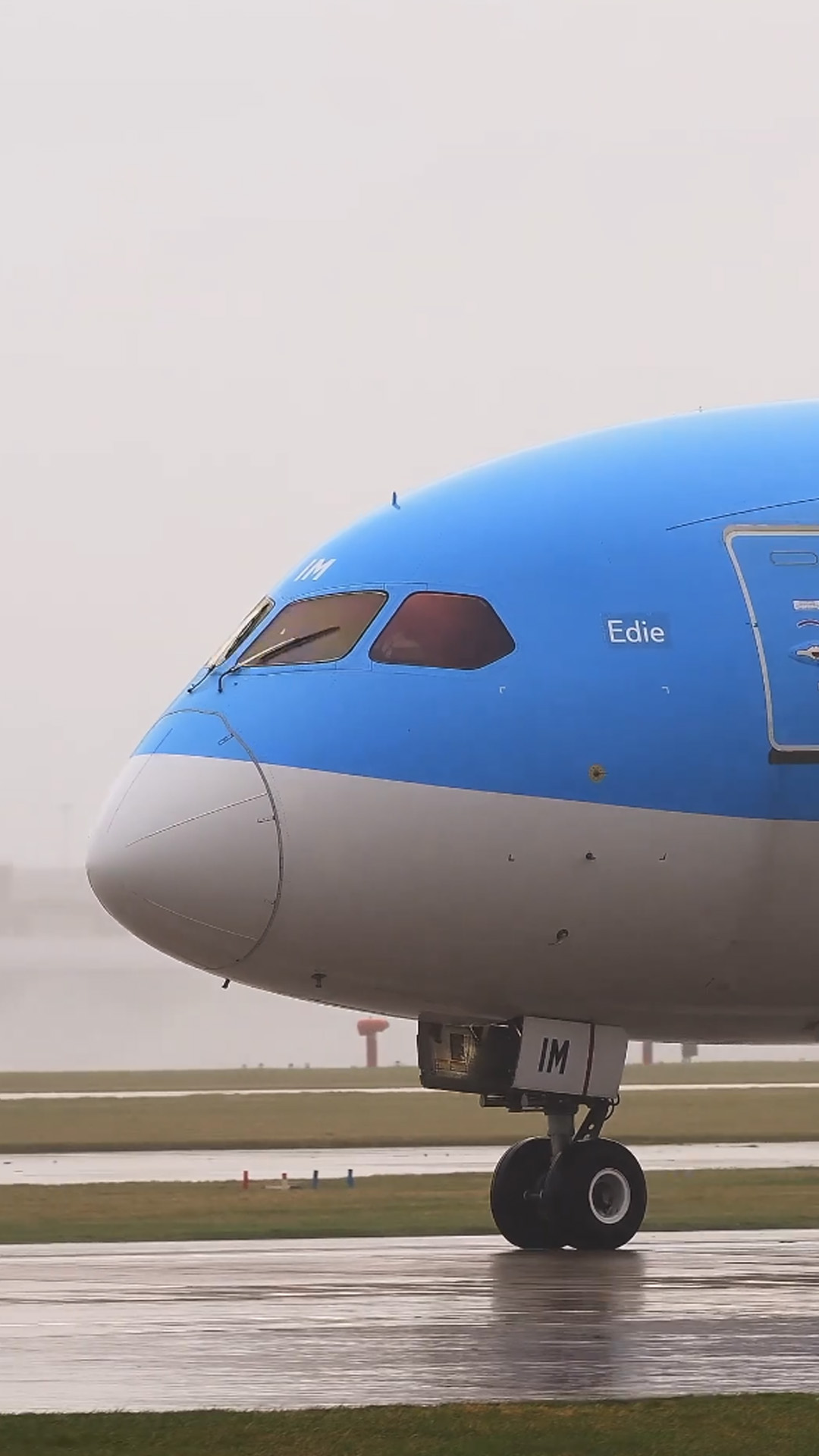 Powerful jet takeoff on wet runway