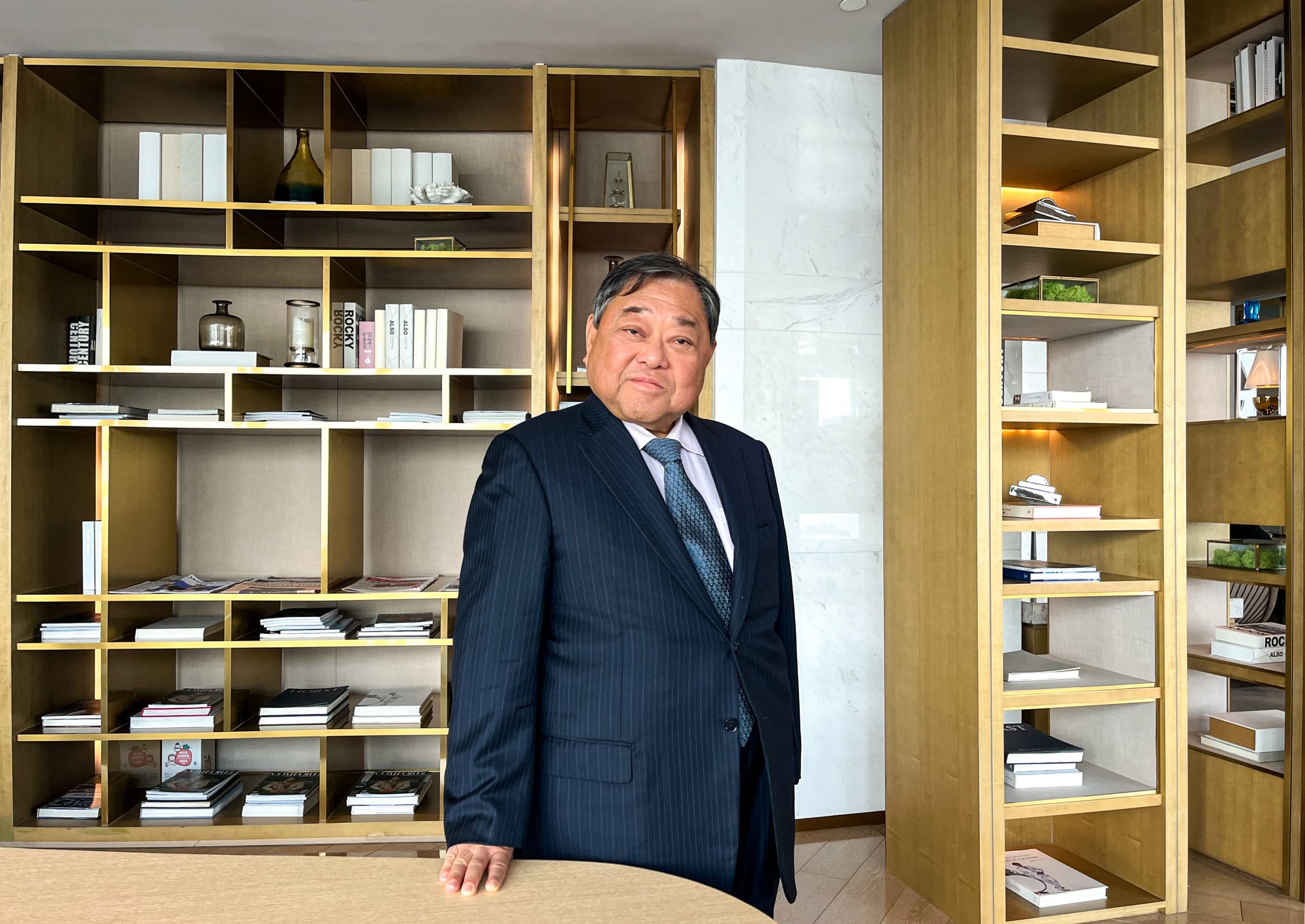 Hong Kong tycoon urges prudent approach to development amid global ...