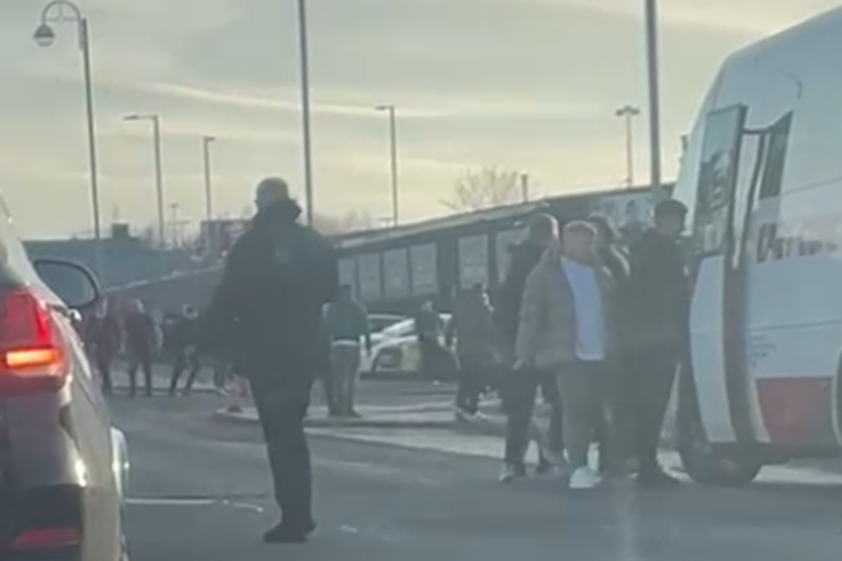 Three charged after Celtic fan attacked walking on supporters' bus