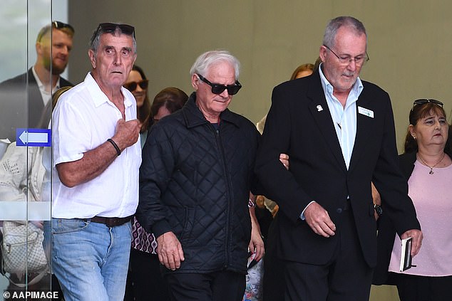 Vyleen's widower Victor (pictured centre) is seen after the sentencing in November 2025