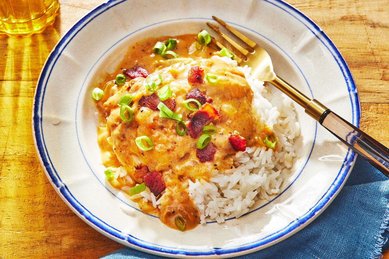 Southern Living Smothered Chicken on a plate to serve with rice