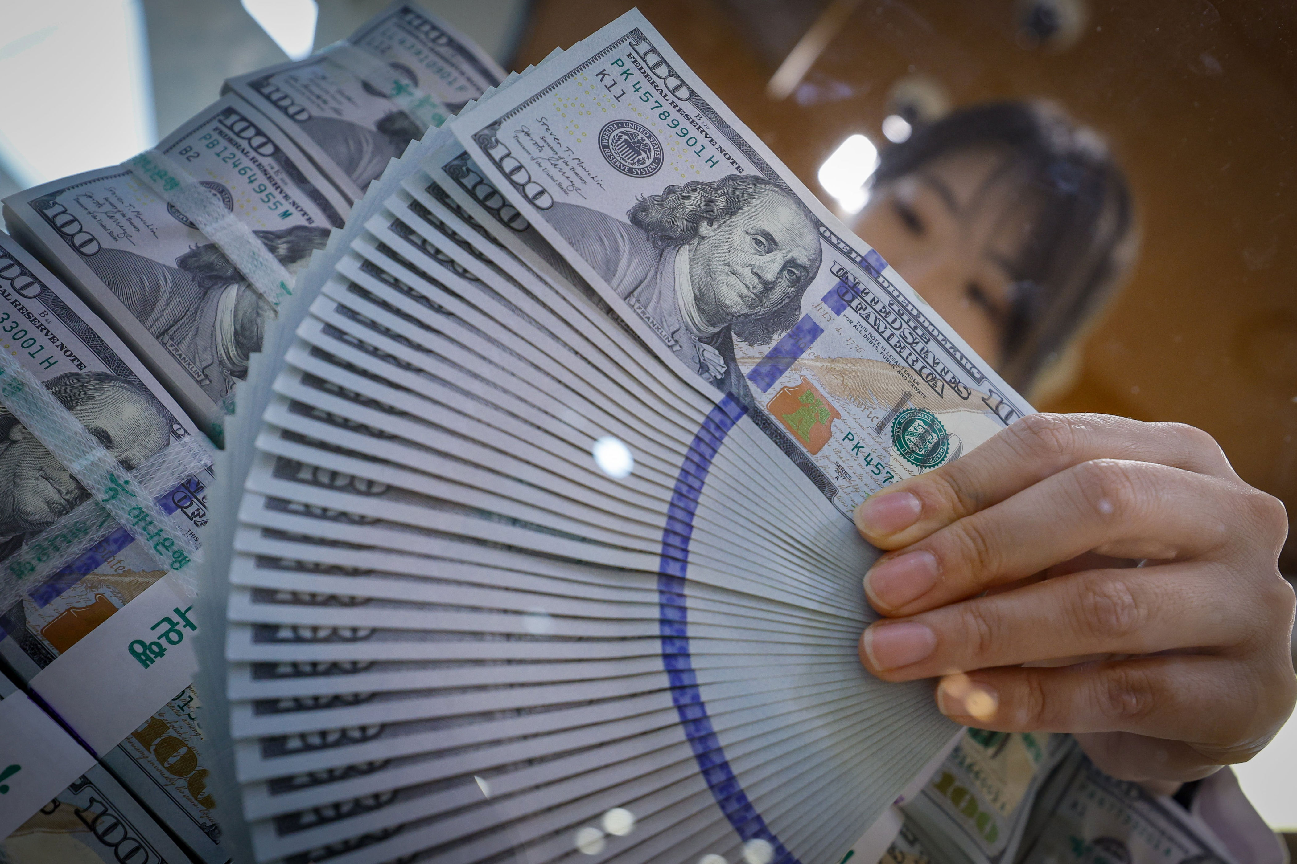 Individuals push dollar deposits to record high