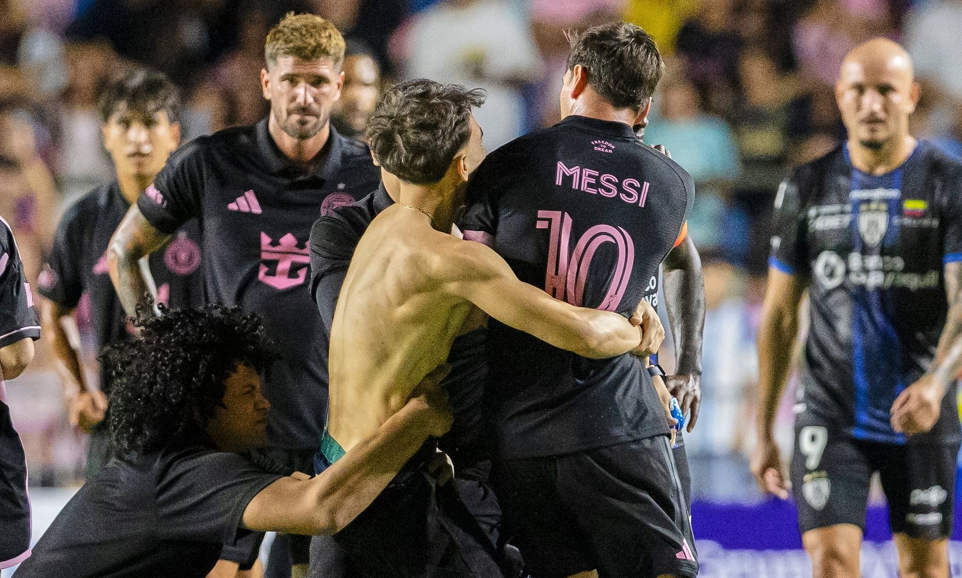 Lionel Messi hauled to ground by clumsy security guard after crazed fan ...