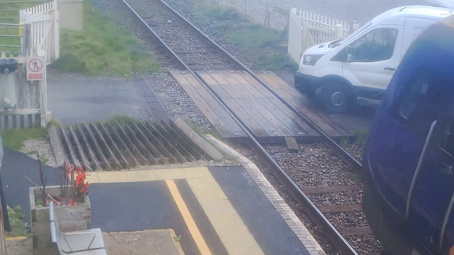 Moment delivery driver crashes van into fast-moving train