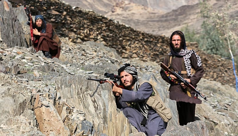 Afghan Taliban soldiers look toward the Pakistani side AP Photo