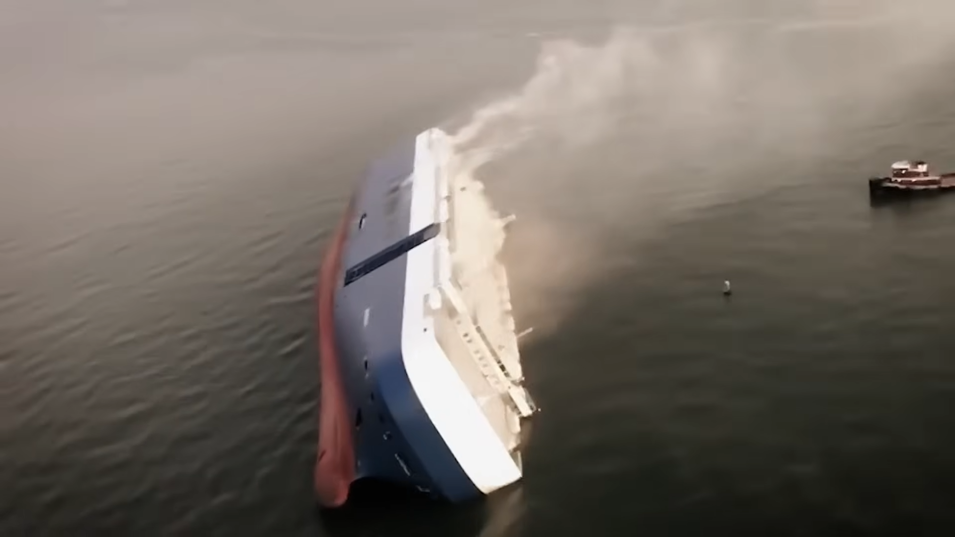 300,000 gallons of fuel and 4,200 cars locked inside a capsized giant