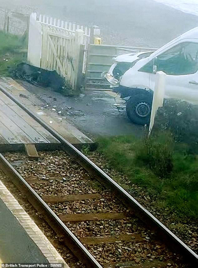 Moment train smashes into van when delivery driver pulled onto crossing ...