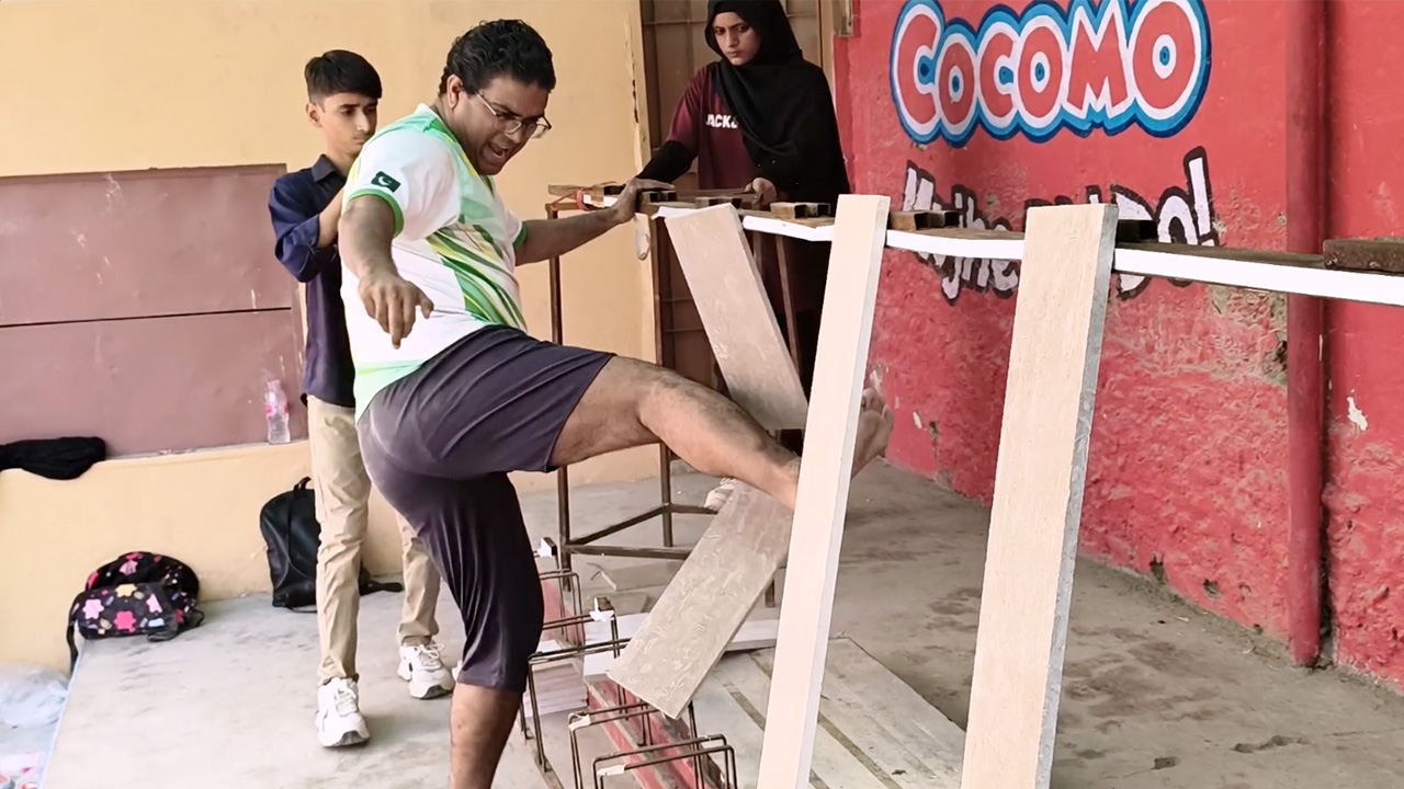 Most marble slabs broken with shins in one minute 41 by Muhammad Rashid