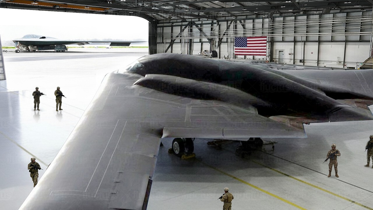 US Air Force rolling out super-stealth bomber from giant hangar<br>